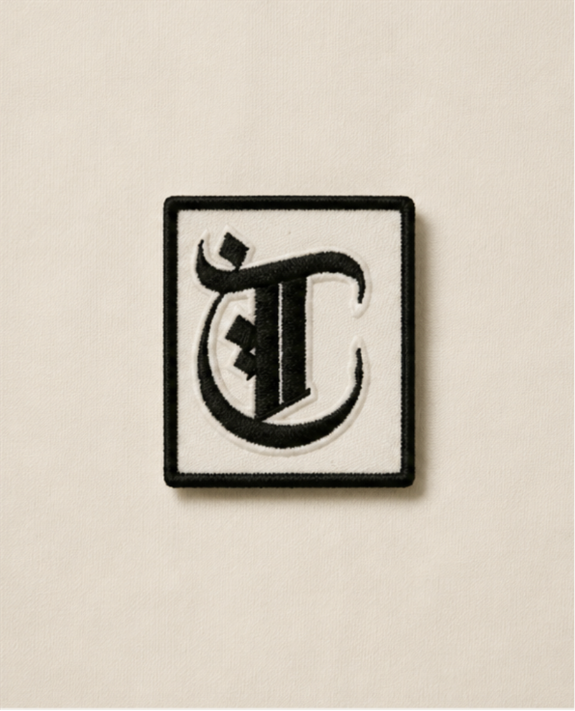 Teespirit Trademark Patch — archive fragment, black embroidered mark on bone