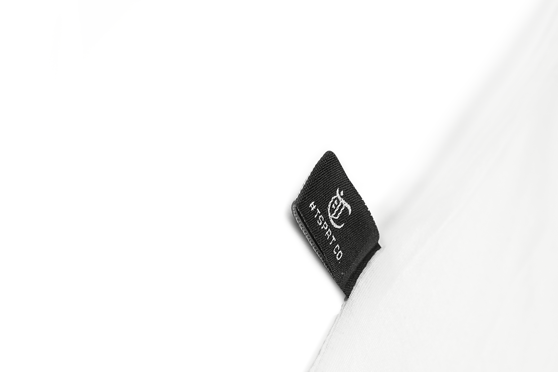 Woven TSPRT CO. label at the hem
